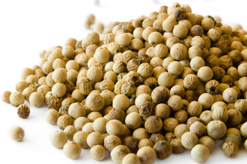 Whole white pepper on white background