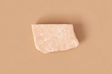 Stone Podium for promotion on beige Background. Natural rock pedestal. Two stones, pampas grass. Beauty product mockup. Scene to show products. Showcase, display case. Top View, soft shadow, Flat lay