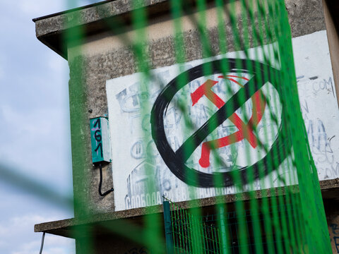 Russian symbol hammer and sickle graffiti crossed out. Sanctions to Russia. Stop the war in Ukraine