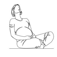 pregnant woman listening to music with headphones