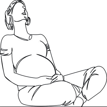 pregnant woman listening to music with headphones
