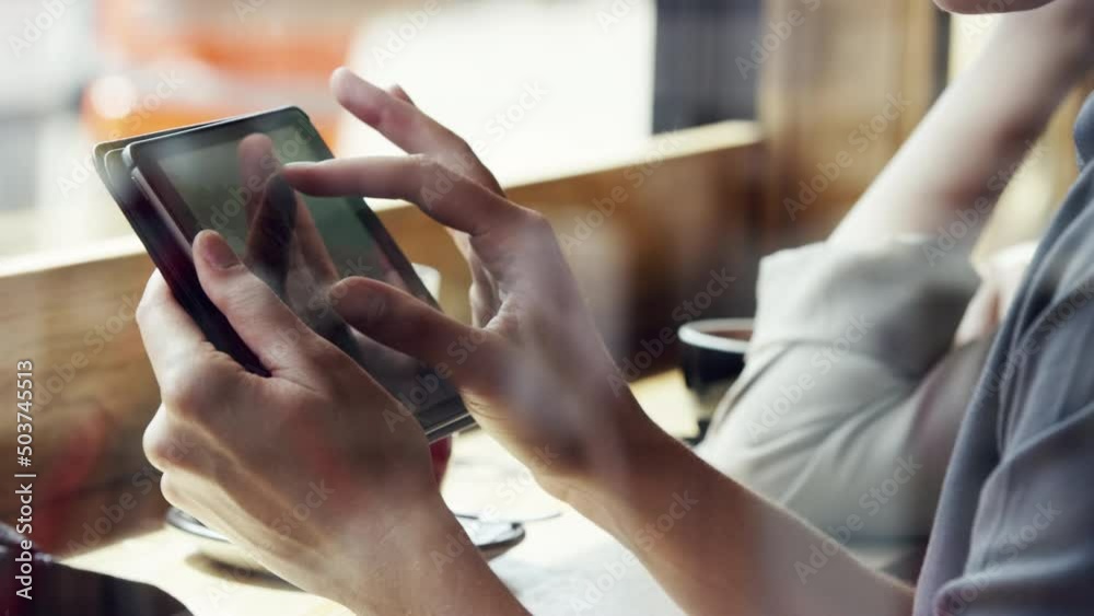 Poster hand of a woman scrolling online on a digital tablet. businesswoman using a wireless tablet in a caf