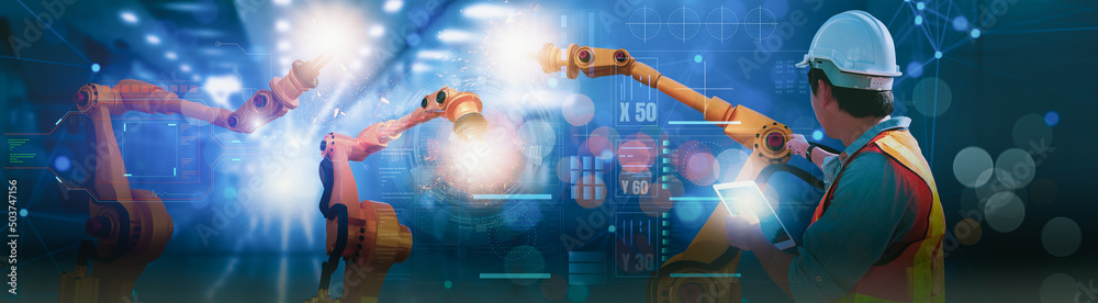 Wall mural industry engineer in factory,using smart tablet glass device,control automated robot arm machine lea