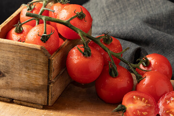 Cherry tomatoes in wooden box