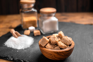 White sugar and brown sugar background. Sweet and tasty. Healthy and unhealthy lifestyle. 