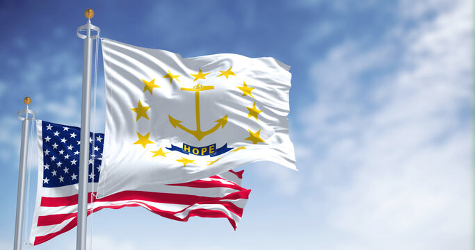 The Rhode Island state flag waving along with the national flag of the United States of America