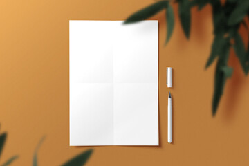 Clean minimal A4 flyer mockup on background with pen and leaves