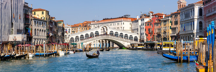Venice Rialto bridge over Canal Grande with gondola travel traveling holidays vacation town panorama in Italy - obrazy, fototapety, plakaty