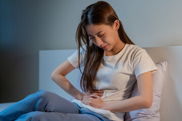 Flatulence ulcer, asian young woman in belly, stomach ache from food poisoning, abdominal pain and...