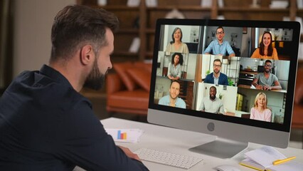 Bearded man in formal wear using app for distance video communication with coworkers, webinar participants, meeting online in pandemic, looking at the laptop screen with people profiles