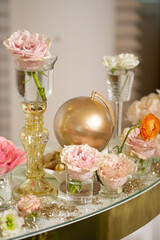 Table setting at a luxury wedding and Beautiful flowers on the table. wedding decor, flowers, pink and gold decor, candles.