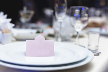 Serving a wedding banquet table in a restaurant with initials, name and date.