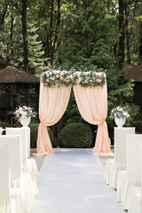 Beautiful wedding arch for an exit ceremony with flowers