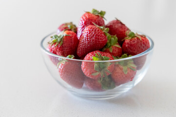 A Bowl of Strawberries in a glass bowl