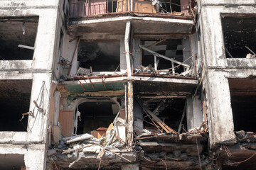 Destroyed apartments in the house after being hit by a downed rocket. A multi-storey building...