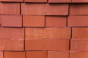 Red brick masonry close-up. Texture for wallpaper. Vintage building blocks. Walls of buildings.