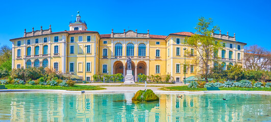 Panorama of Palazzo Dugnani in Public Park of Montanelli with a pond with fountain, Milan, Italy