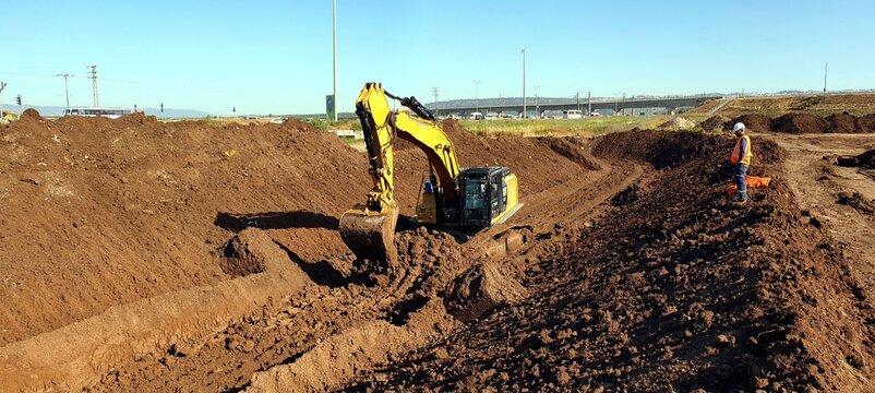 construction site, road construction, road works, at the construction site, excavation, earthwork, digging, excavator, trench  digging,  digging a pit, soil movement, foundation digging.