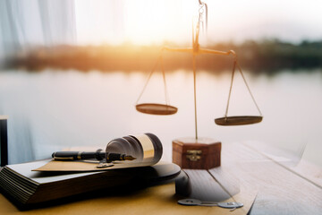 justice and law concept.Male judge in a courtroom on wooden table and Counselor or Male lawyer...