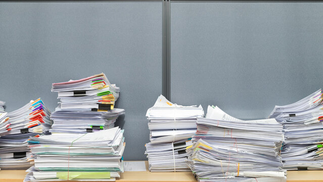 Business documents stack on table, report papers stack.