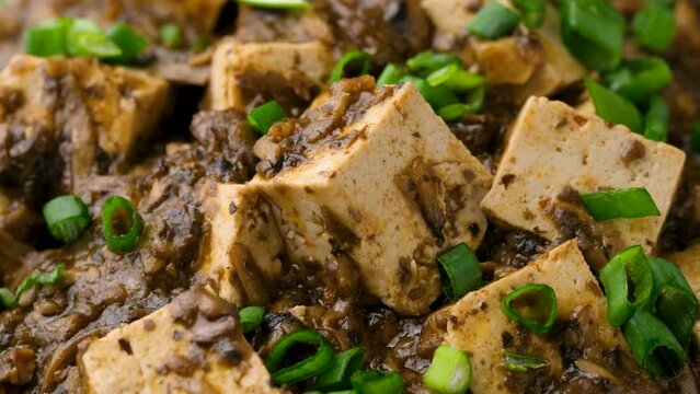 Vegan Mapo tofu with mushroom and rice. Asian, Chinese food. Rotating video