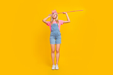 Full body portrait of minded clueless girl net head look interested empty space isolated on yellow color background