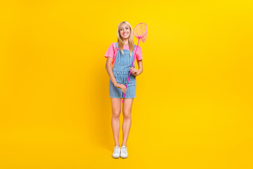 Full body photo of friendly cute girl hands hold insect net toothy smile isolated on yellow color background