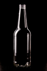 empty bottle on a dark background