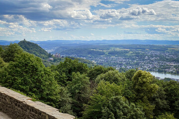 Scenic view from Petersberg mountain at Siebengebirge mountain range in Germany overlooking Drachenburg castle, river Rhine and Bad Godesberg.
