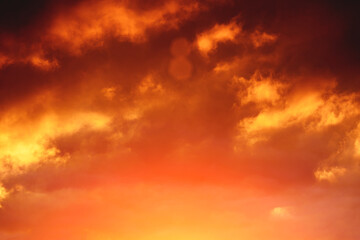 Clouds illuminated by the setting sun. Colorful sunset in the evening sky. Meditative calmness and greatness. Amazing sky panorama. Mystical lighting. Great dramatic view