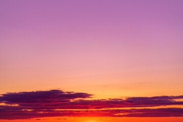 Mystical lighting. Great dramatic view. Colorful sunset in the evening sky. Meditative calmness and greatness. Amazing sky panorama. Clouds illuminated by the setting sun