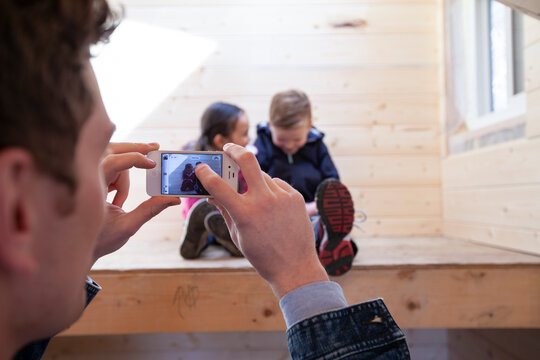 Dad Taking Picture Of Kids