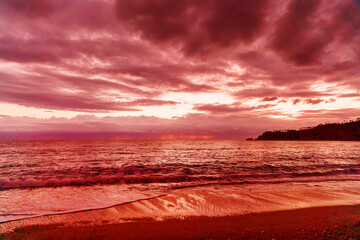 Amazing sky panorama. Clouds illuminated by the setting sun. Great dramatic view. Colorful sunset in the evening sky. Meditative calmness and greatness. Mystical lighting