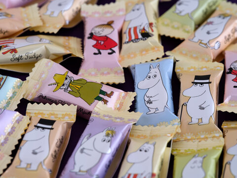 Tambov, Russian Federation - April 27, 2022 Close-up of Moomin Soft fudge candies by Fazer. The fudge comes single wrapped, with 9 different characters printed on the wrapper.