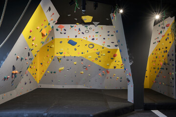 Empty bouldering walls with many handles
