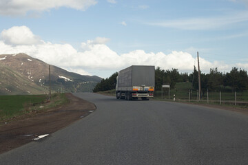A big truck  on a countryside road