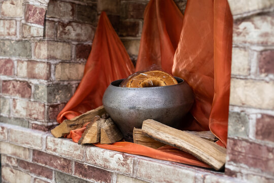 decor in the form of a cauldron in the fireplace