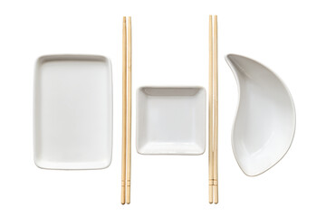 Bamboo chopsticks and various white empty plates, isolated on a white background