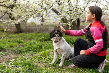 happy child girl with her dog