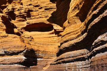 Interesting rock formation in layers, from the yellow mountain (Montaña Amarilla), in Canary Islands