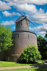 View on medieval historical brick stone tower windmill, blue sky - Kempen, Germany
