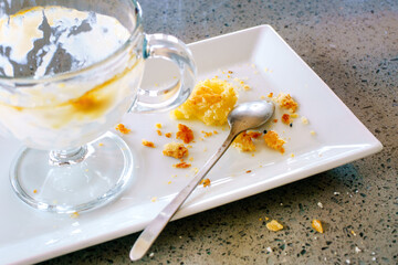 Delicious lovely breakfast. Empty dishes and crumbs on the glass after breakfast. Leftover food in dirty glasses