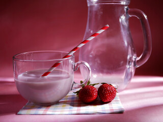 Strawberry milkshake on pink background medium shot 