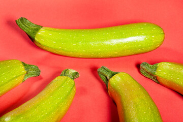 zucchini group on red background