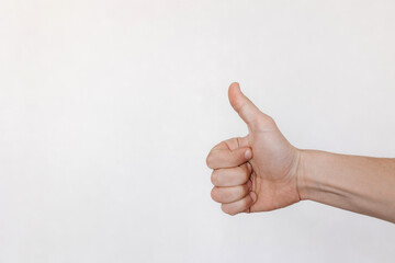 hand on white background with thumb up