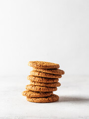 Stack of oatmeal cookies on white background