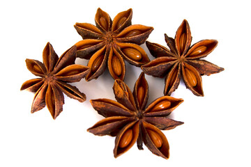 Star anise spice fruits and seeds isolated on white background close-up. Top view