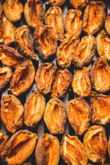 The process of home cooking dried fruits in an electric dryer.