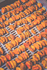 The process of home cooking dried fruits in an electric dryer.