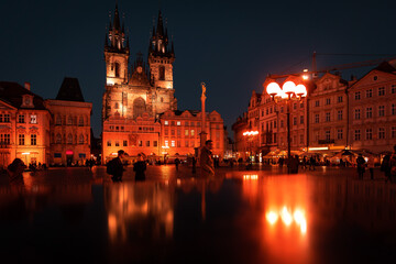 Tyn Church, Czech Republic, Prague, Old Town Square Nigh city center illumination. Downtown area Evening lights.